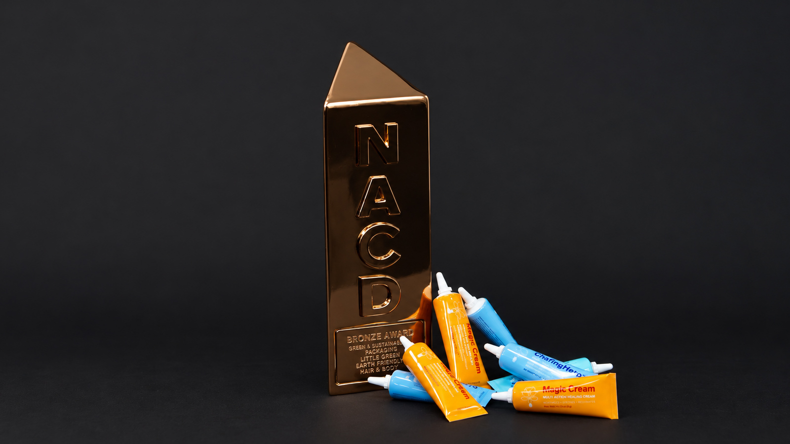 Magic Cream and ChafingHero multi-action healing cream tubes — NACD 2025 Bronze award-winning package