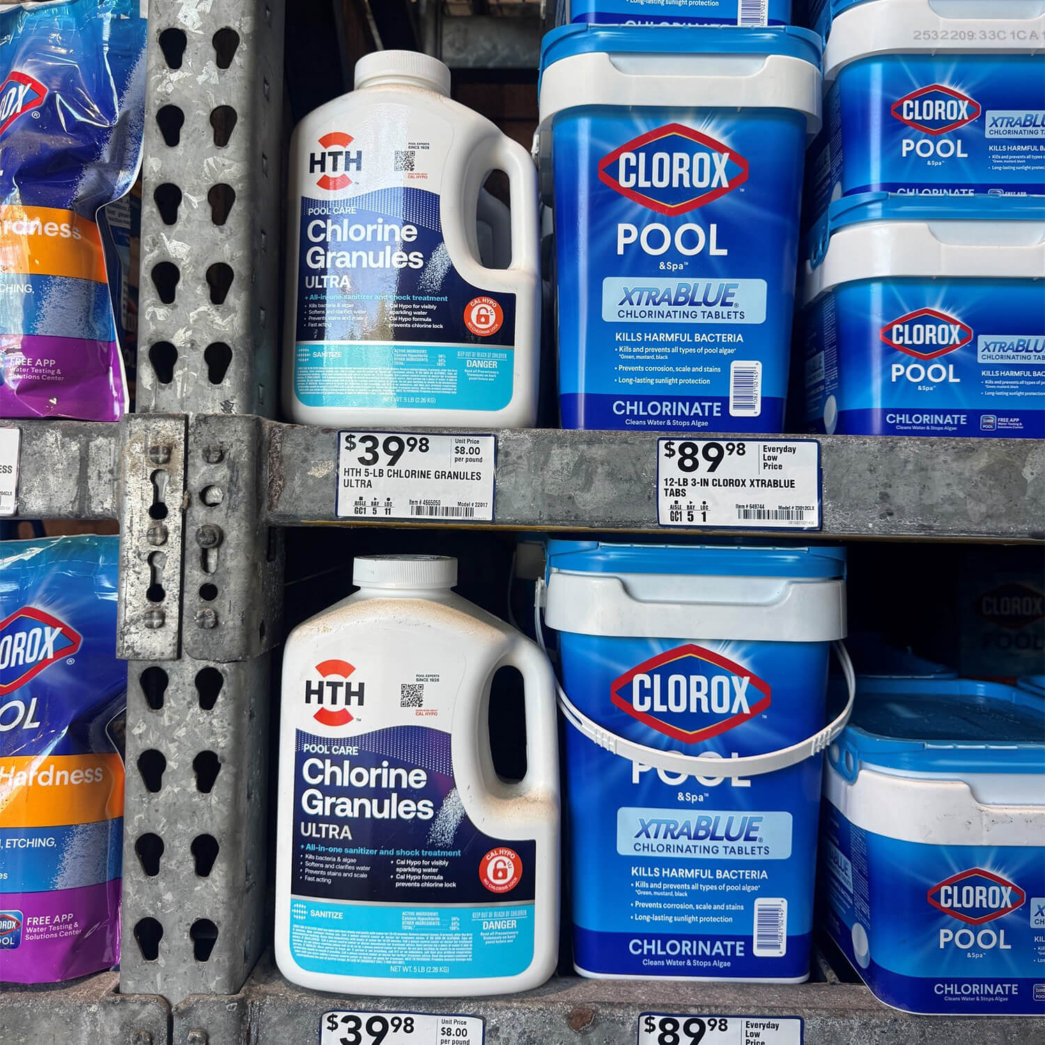 HTH chlorine granule jugs and Clorox Pool tablet pails with pressure-sensitive labels on a store shelf