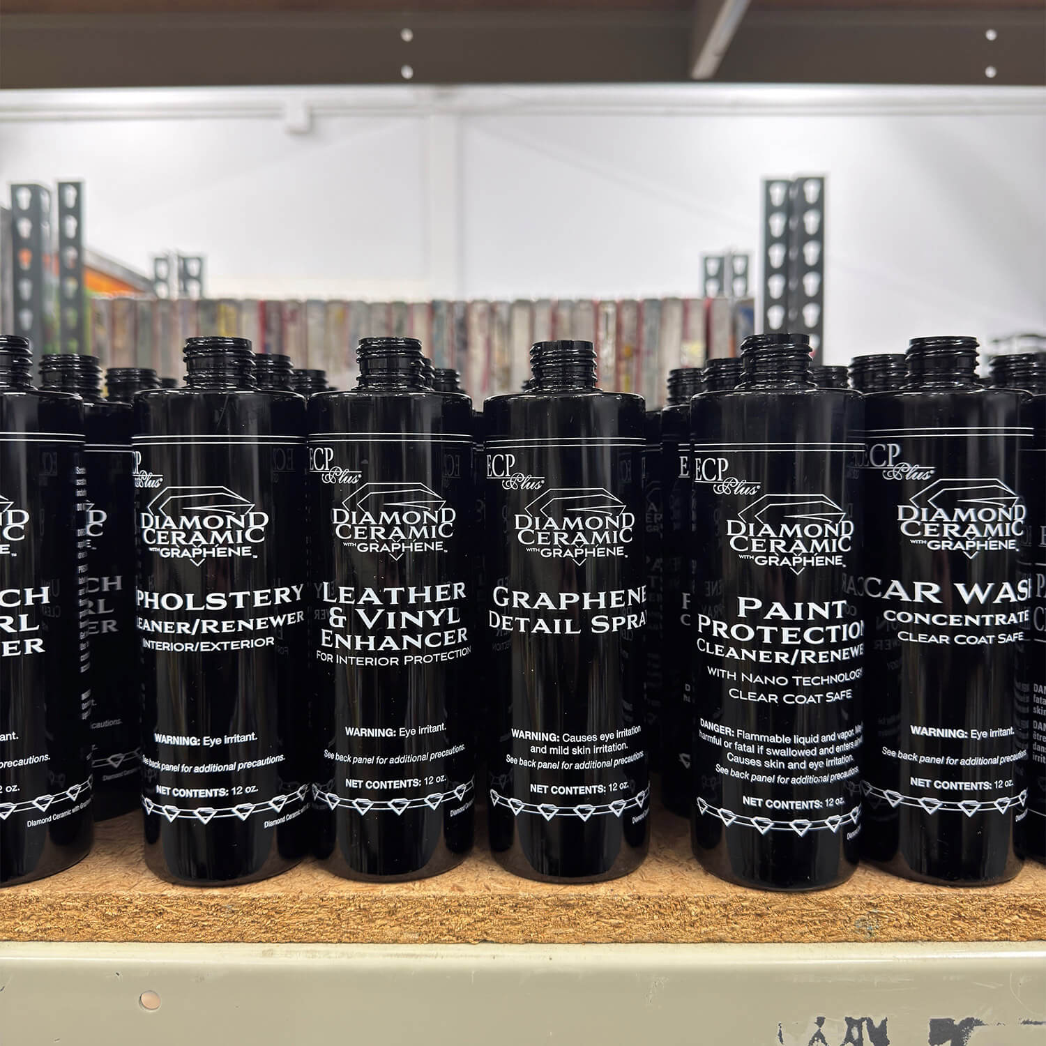 Rows of black ECP Plus Diamond Ceramic car care bottles with screen-printed white graphics