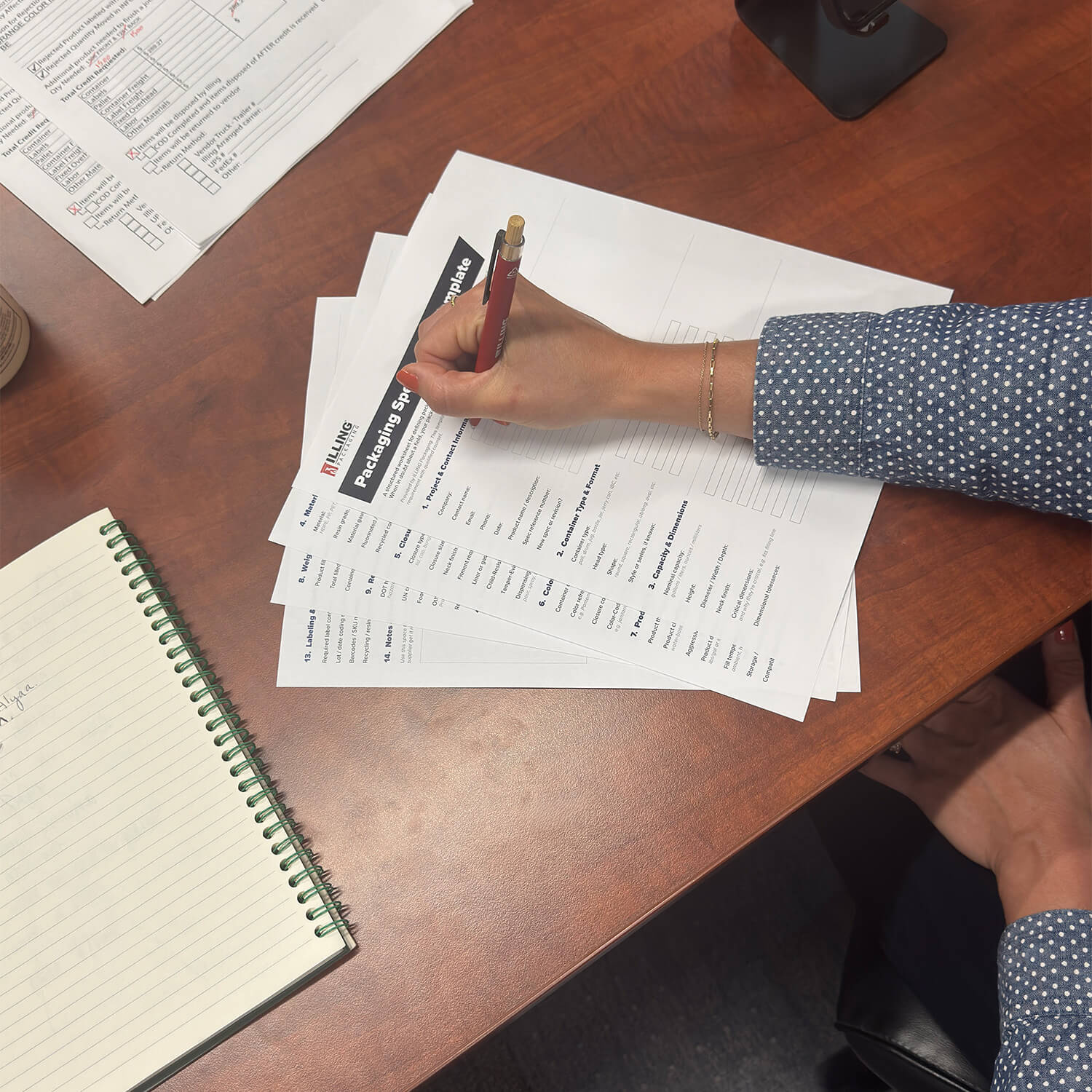 A person filling out ILLING’s packaging spec template form