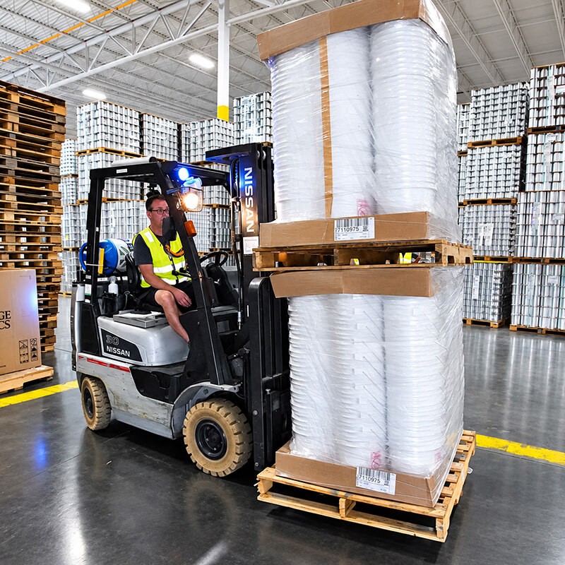 An ILLING warehouse worker preparing an order for shipment
