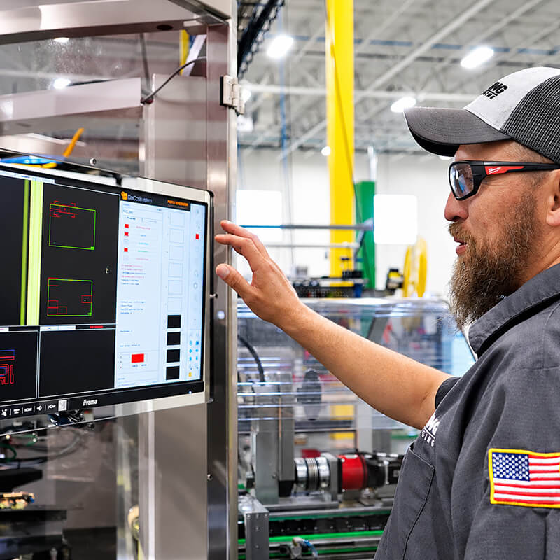 An ILLING engineer reviewing artwork at a screen